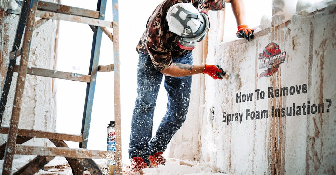 Construction worker removing spray foam on the walls of a building